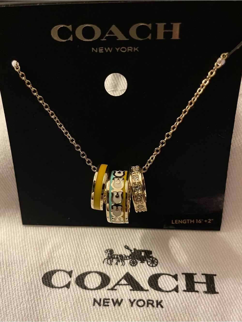 Coach Gold-Tone Pendant Necklace with Yellow and White Accents - Picture 2 of 4